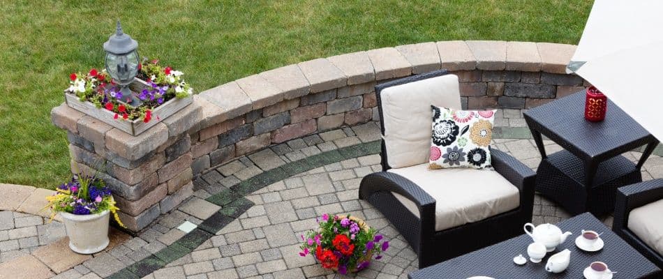 content-stone-seating-wall-by-outdoor-kitchen-area